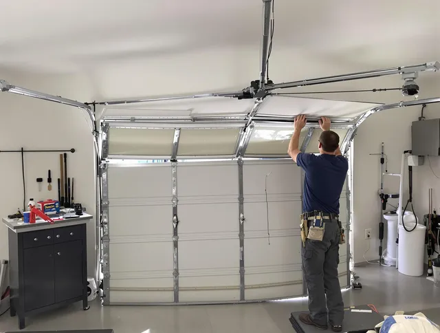Seekonk Garage Door Repair specialist performing precise section replacement on Seekonk garage door